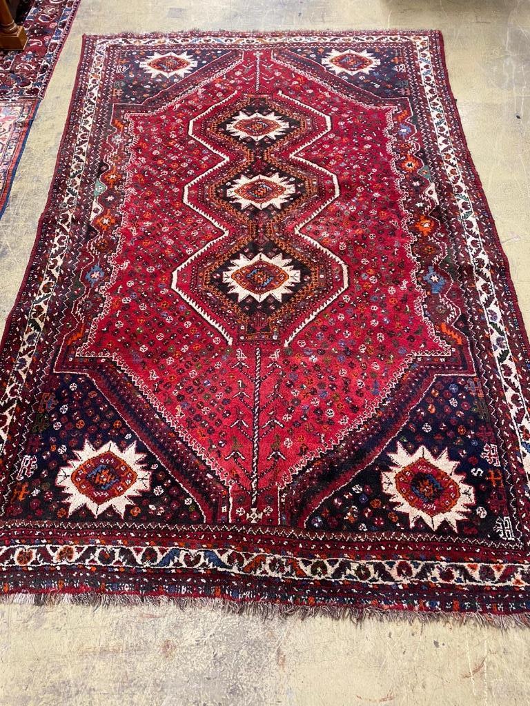 A Caucasian design red ground carpet, 336 x 220cm